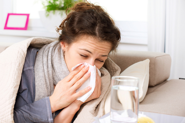 Flu or Cold. Sneezing Woman Sick Blowing Nose